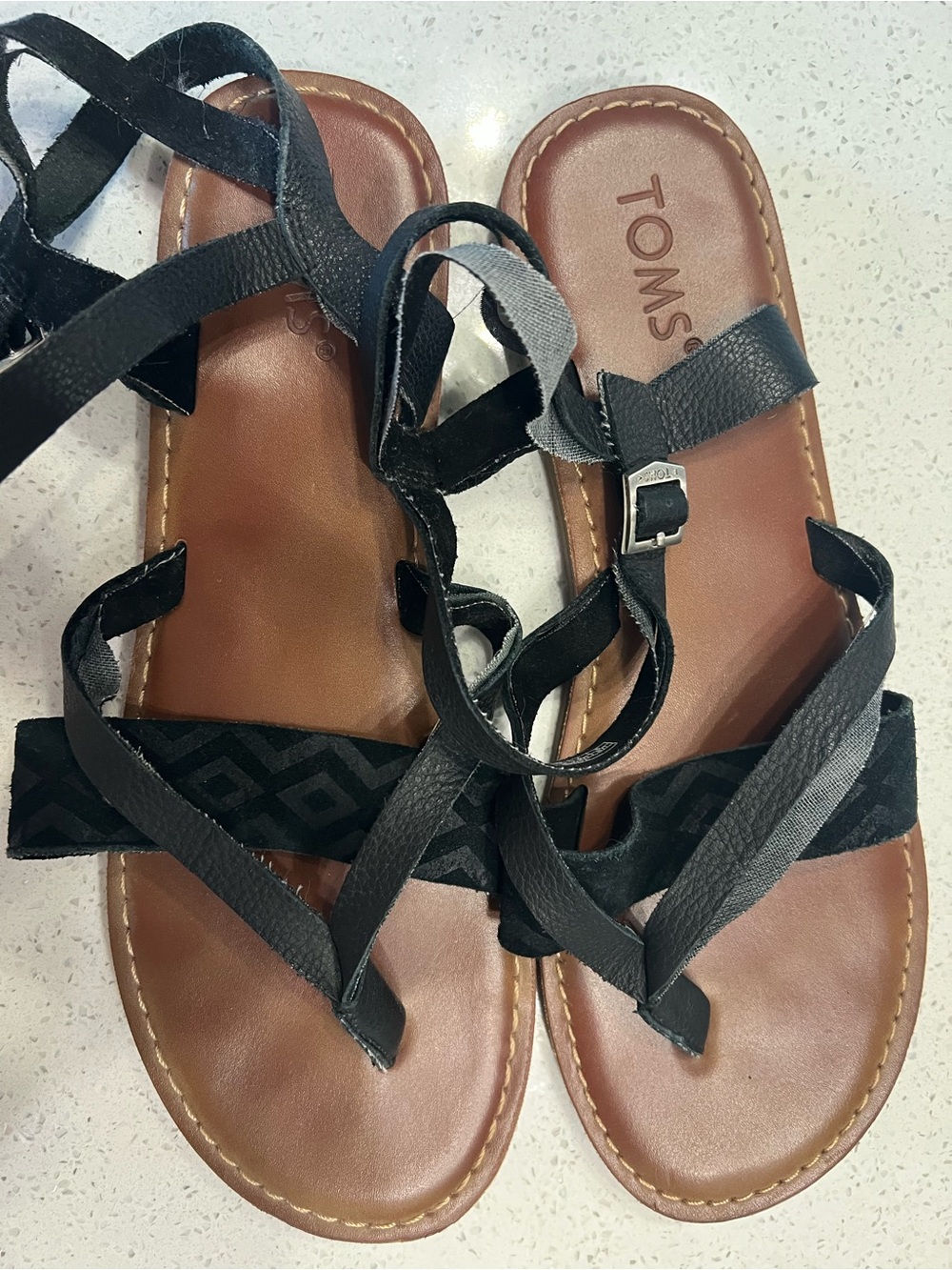 Toms Lexie Black Strappy Leather Wrap Sandals with Brown Footbed Women’s size 9.